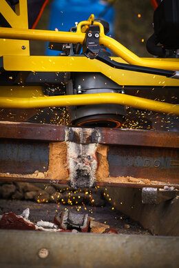 Grinding wheel of the profile grinder on Thermit weld to be ground